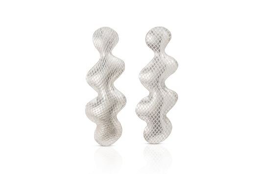 A pair of textured silver earrings with a wavy, snake-like vertical design, displayed on a clean white background.