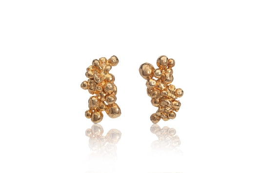 Earrings crafted from recycled sterling silver with 22-carat yellow gold plaiting, featuring a unique, mismatched design created using the granulation technique. Post earrings with butterfly backings, perfect for adding a touch of sustainable glamour.